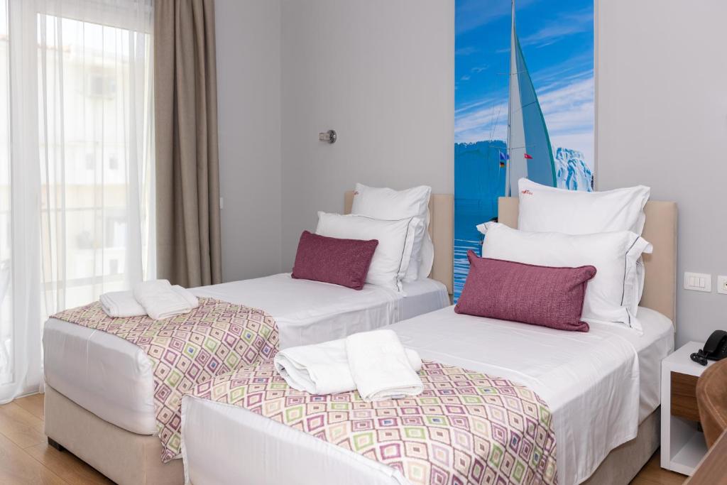 Postel nebo postele na pokoji v ubytování Hotel Britania