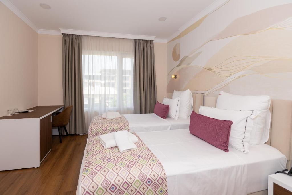 Postel nebo postele na pokoji v ubytování Hotel Britania