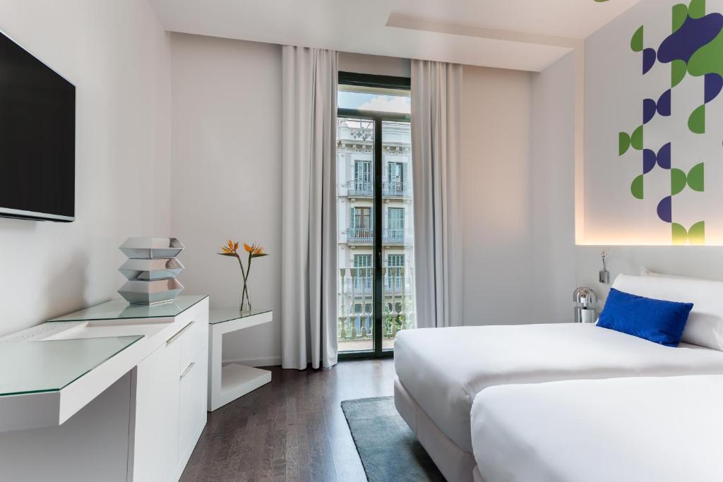 Postel nebo postele na pokoji v ubytování Room Mate Carla, Barcelona