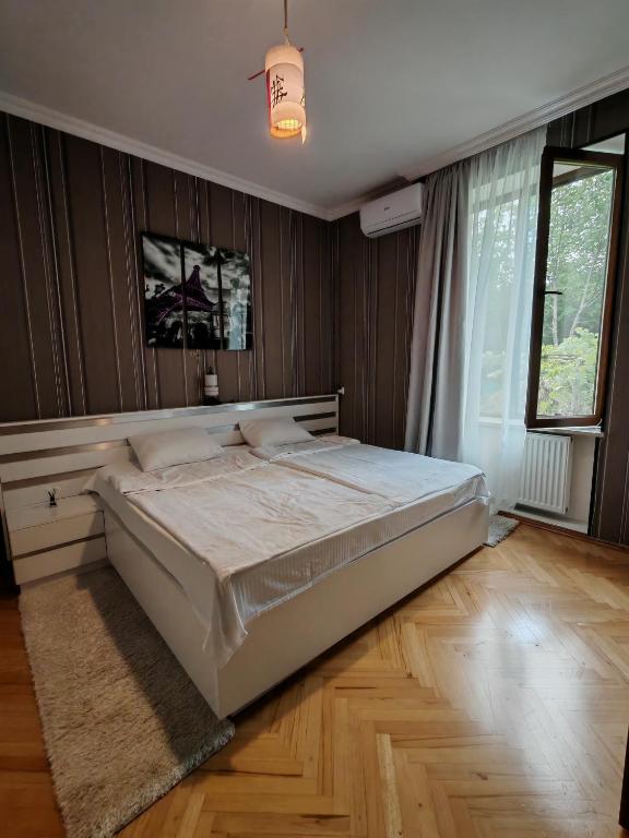 Voodi või voodid majutusasutuse Qilimcha's Guesthouse-Art Museum toas