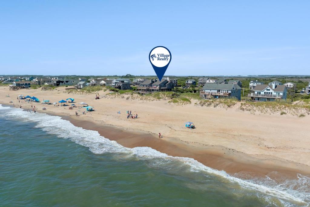 a hot air balloon flying over a beach at The Lily Pad in Nags Head