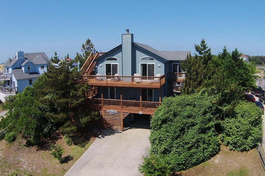 an aerial view of a house with a large deck at My Happy Place by Village Realty in Corolla