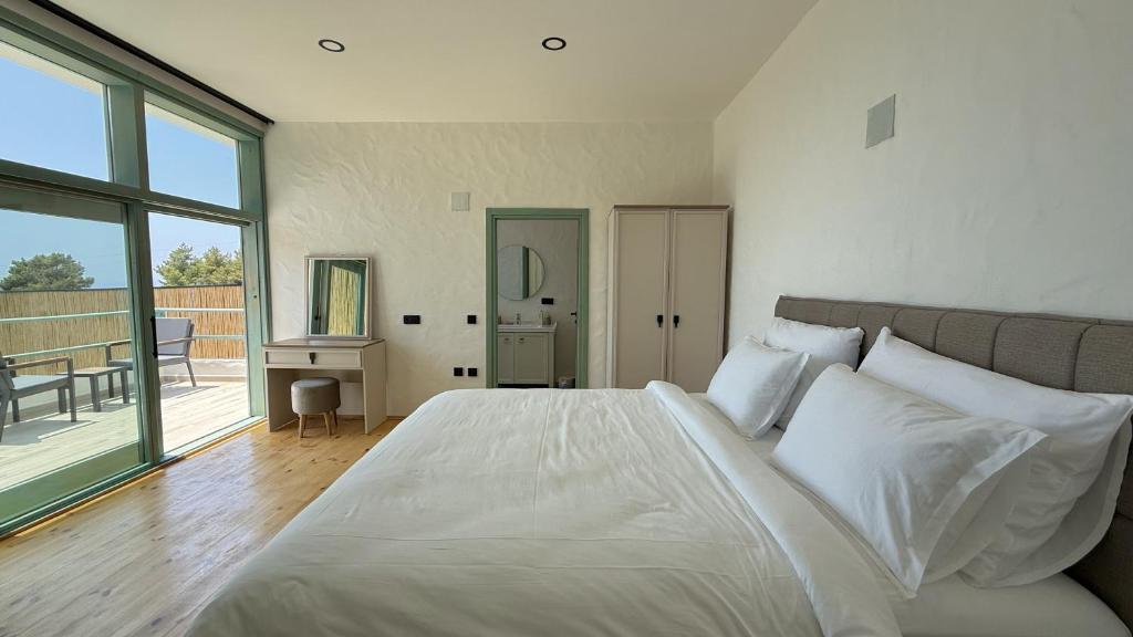 A bed or beds in a room at Seaview Faralya