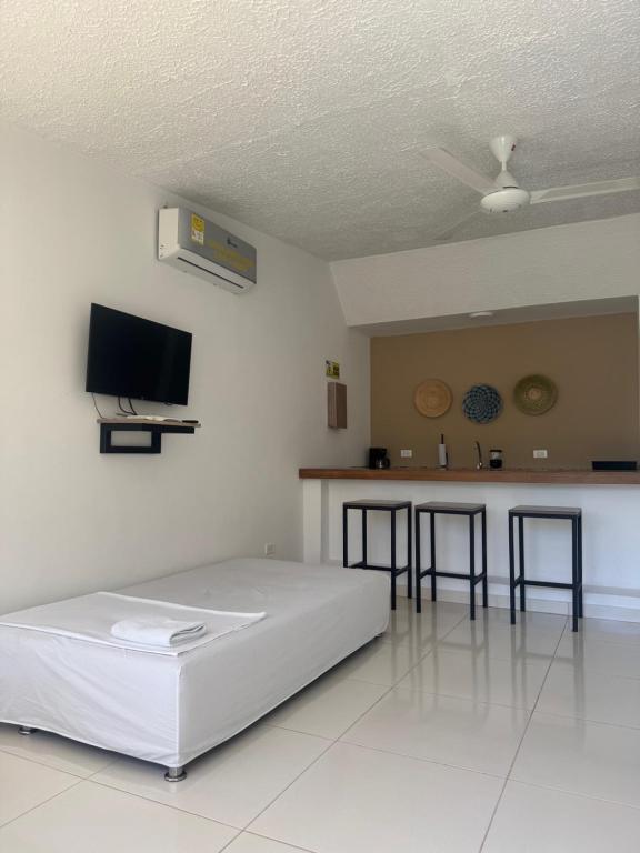 TV a/nebo společenská místnost v ubytování Hotel TACALOA INN EXPERIENCE