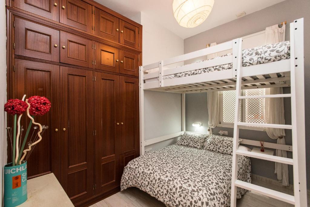 Posteľ alebo postele v izbe v ubytovaní Divi Apartments Valvanera