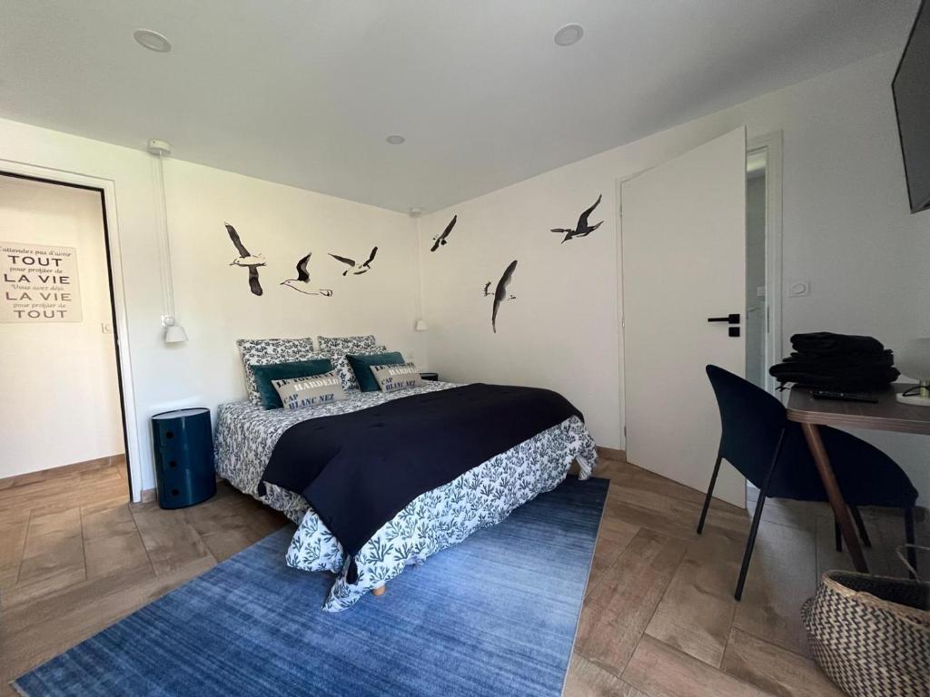 Postel nebo postele na pokoji v ubytování Art de l'Ô chambre d'hôtes