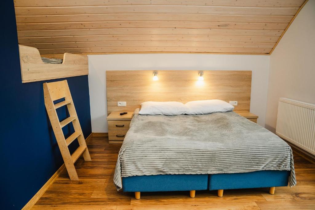 Posteľ alebo postele v izbe v ubytovaní Rellim Apartamenty