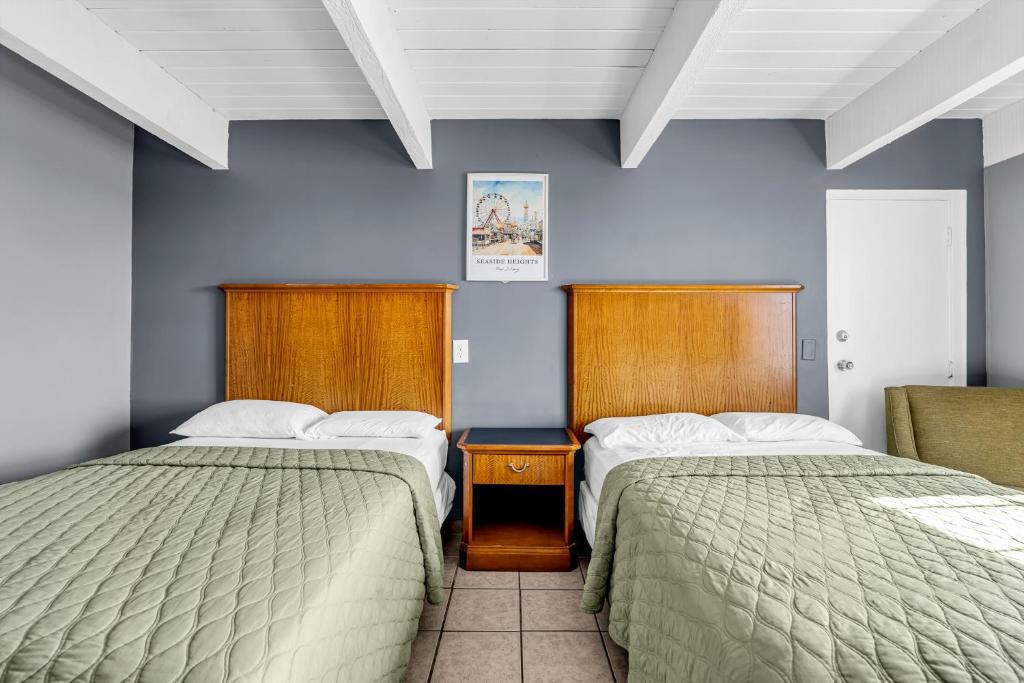 Postel nebo postele na pokoji v ubytování Aztec Ocean Resort