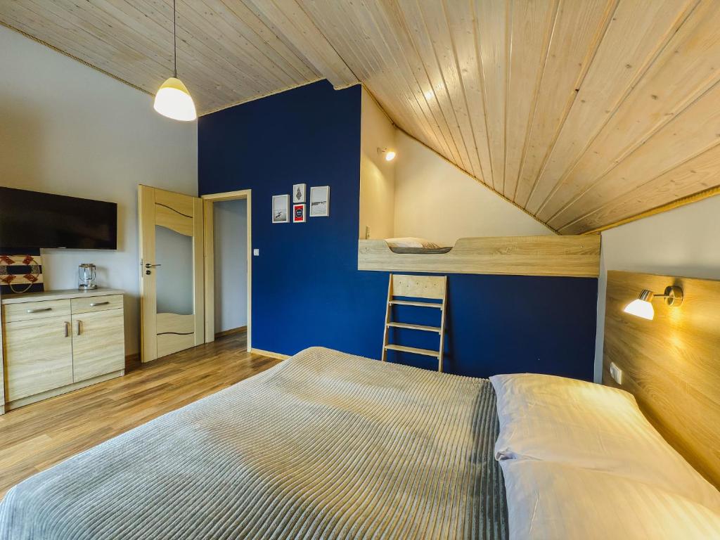 Posteľ alebo postele v izbe v ubytovaní Rellim Apartamenty