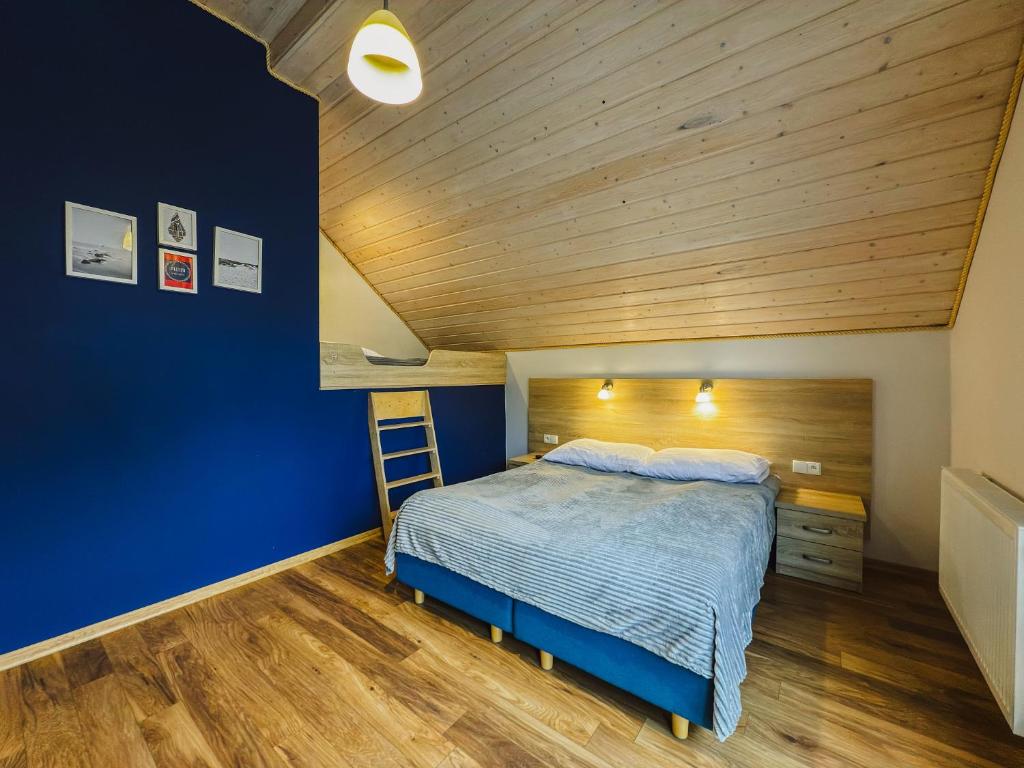 Posteľ alebo postele v izbe v ubytovaní Rellim Apartamenty