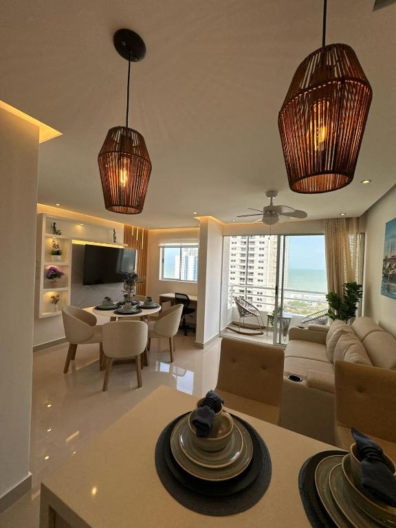 a large living room with a dining room and a living room at Luxury apartment with sea view in Cartagena de Indias