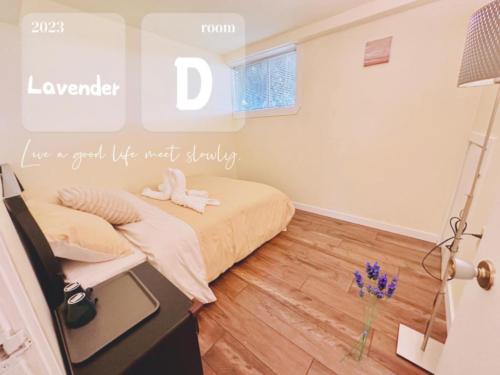 a bedroom with a bed and a vase of flowers at Lavender house in Richmond