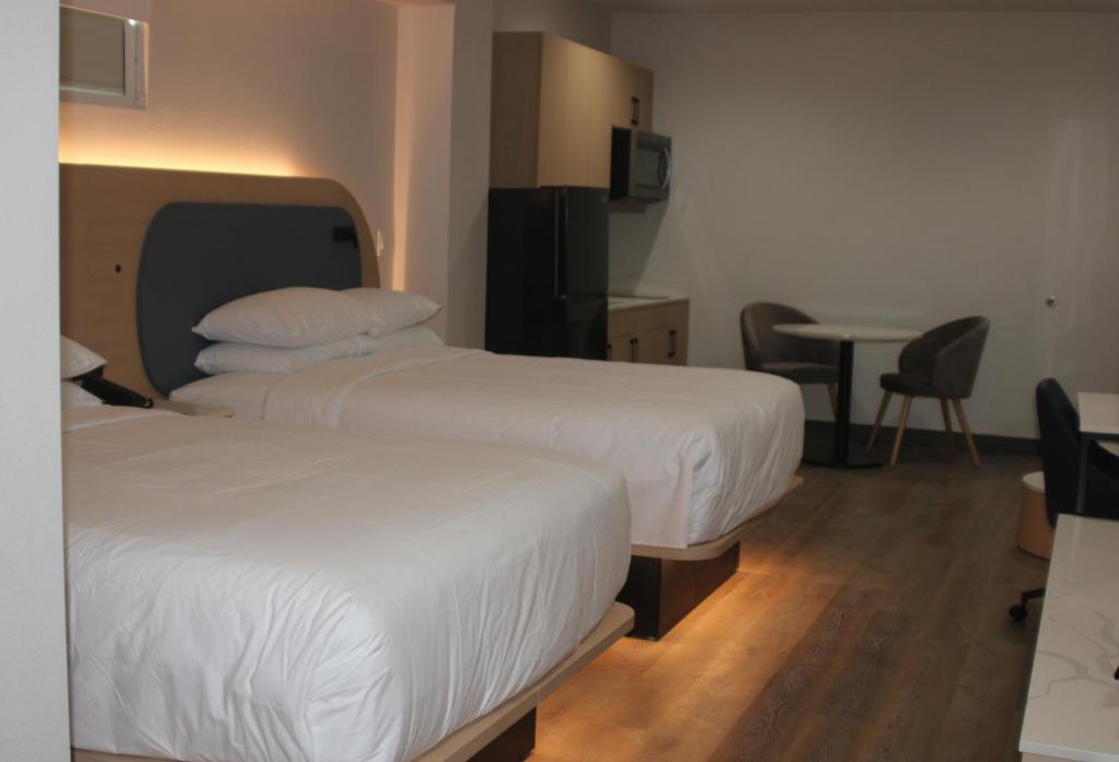 Postel nebo postele na pokoji v ubytování Hotel Lydia