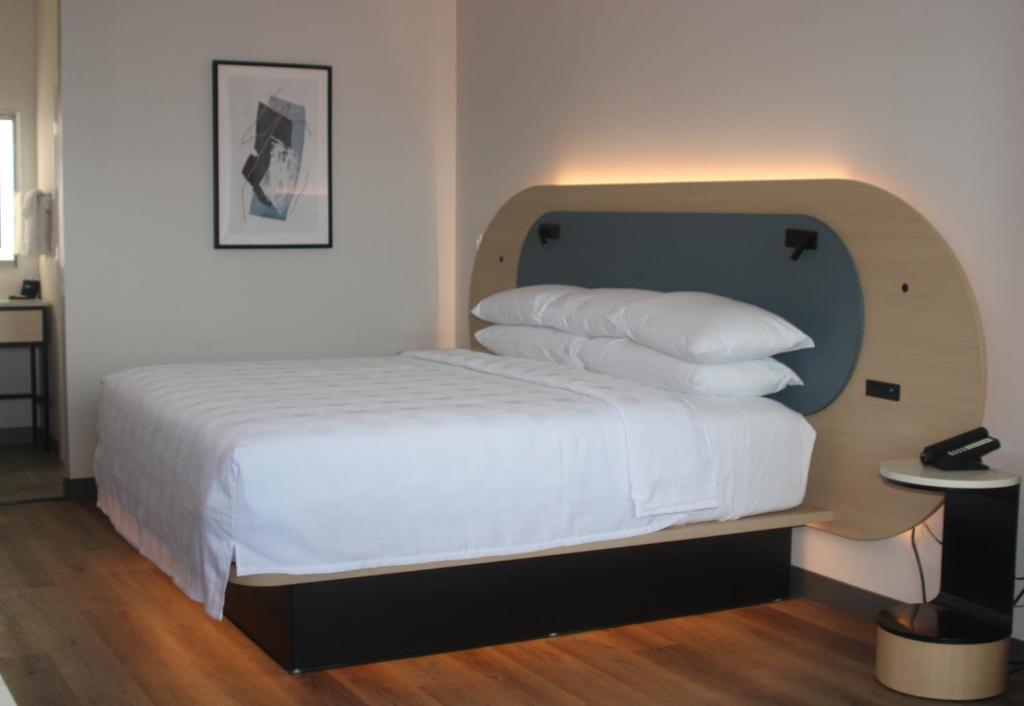 Postel nebo postele na pokoji v ubytování Hotel Lydia