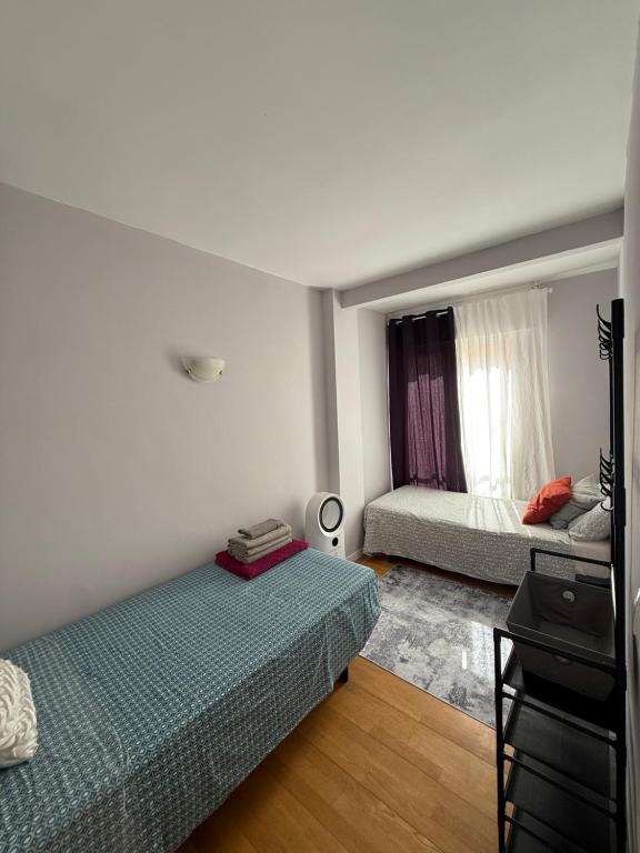 a bedroom with a bed and a mirror and a bed sidx sidx sidx at Cosy and Secure Room Marbella Center in Marbella