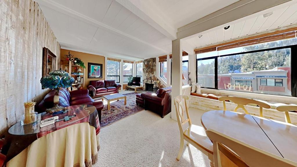 a living room with a couch and a table at Upgraded 2 Bedroom Condo with Pool in Mammoth Lakes