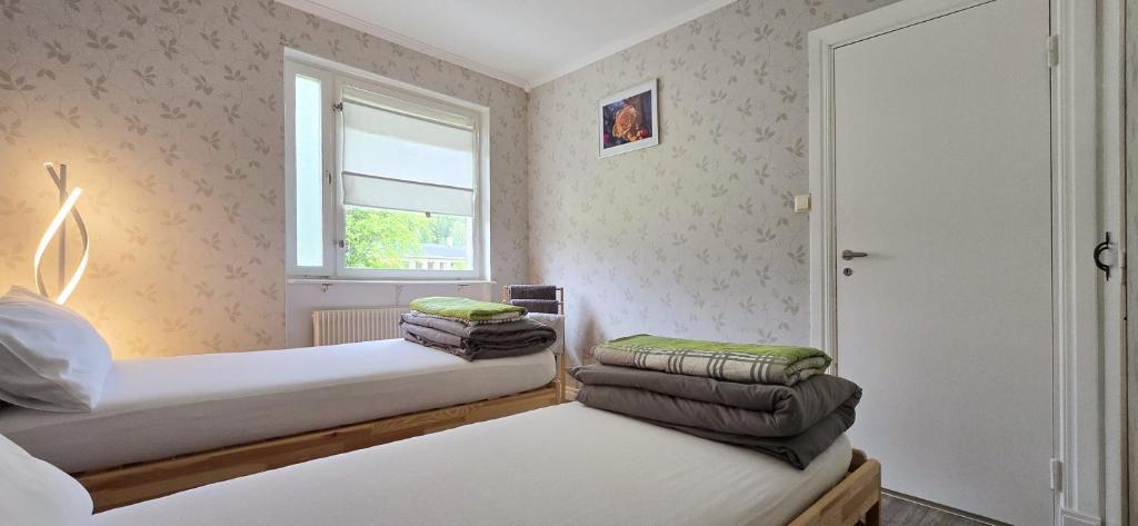 Postel nebo postele na pokoji v ubytování Hus Klarälven