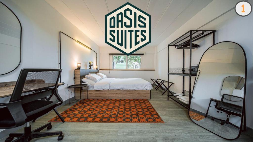 a bedroom with a bed and a large sign on the wall at Oasis Suites Pattaya in Pattaya Central
