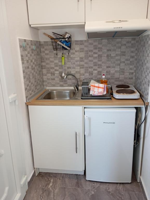 Kuchyň nebo kuchyňský kout v ubytování Cristi Apartments