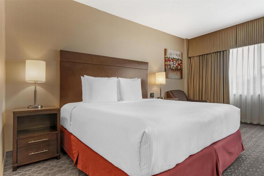 a large white bed in a hotel room at Best Western Terrace Inn in Terrace