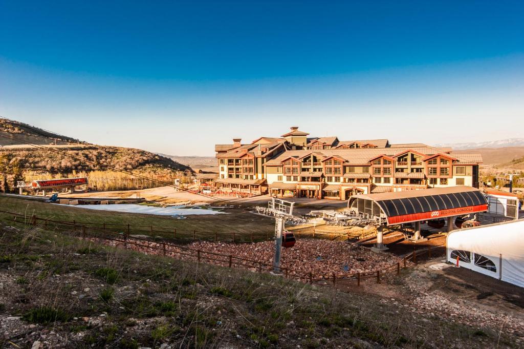 a large building with a train station in front of it at Ski-in/Ski-out 3 Bedroom Canyons Resort in Park City