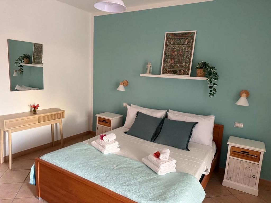 a bedroom with a bed with towels on it at CasaMirea in Lipari