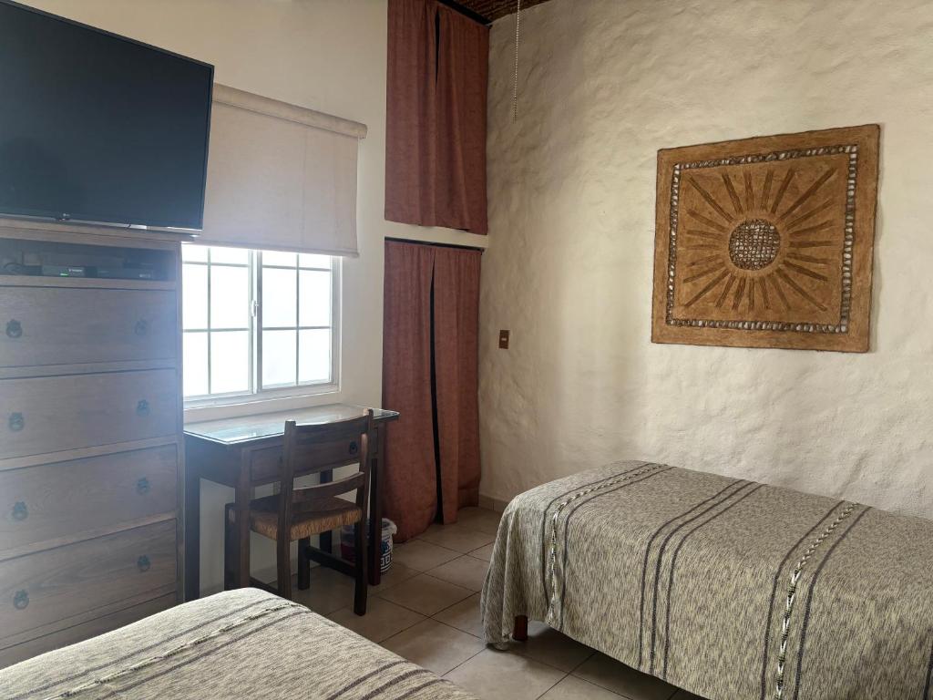 Postel nebo postele na pokoji v ubytování Quinta Don Jose Boutique Hotel