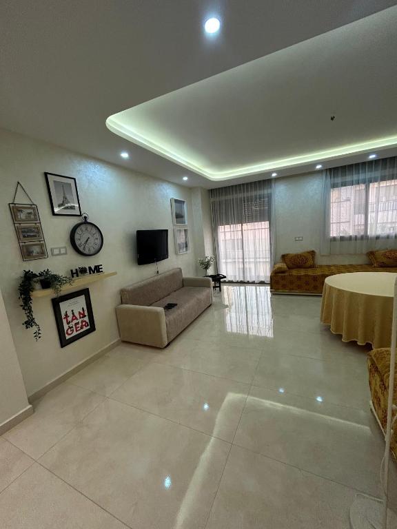 TV a/nebo společenská místnost v ubytování O' appartement Alhoceima