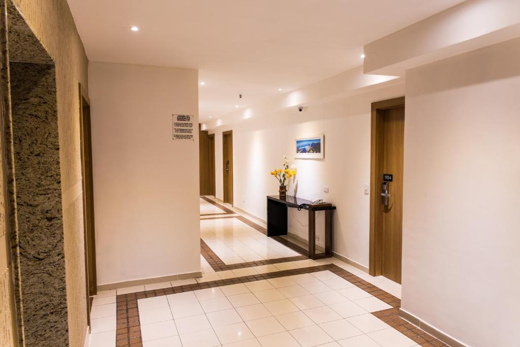 a corridor of a hotel with a hallway at Atlantis Copacabana Hotel in Rio de Janeiro