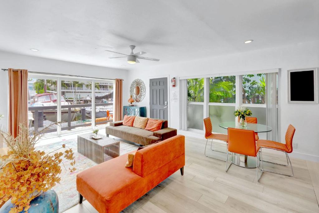 a living room with a couch and a table at Orange Dream on the Water in Fort Lauderdale