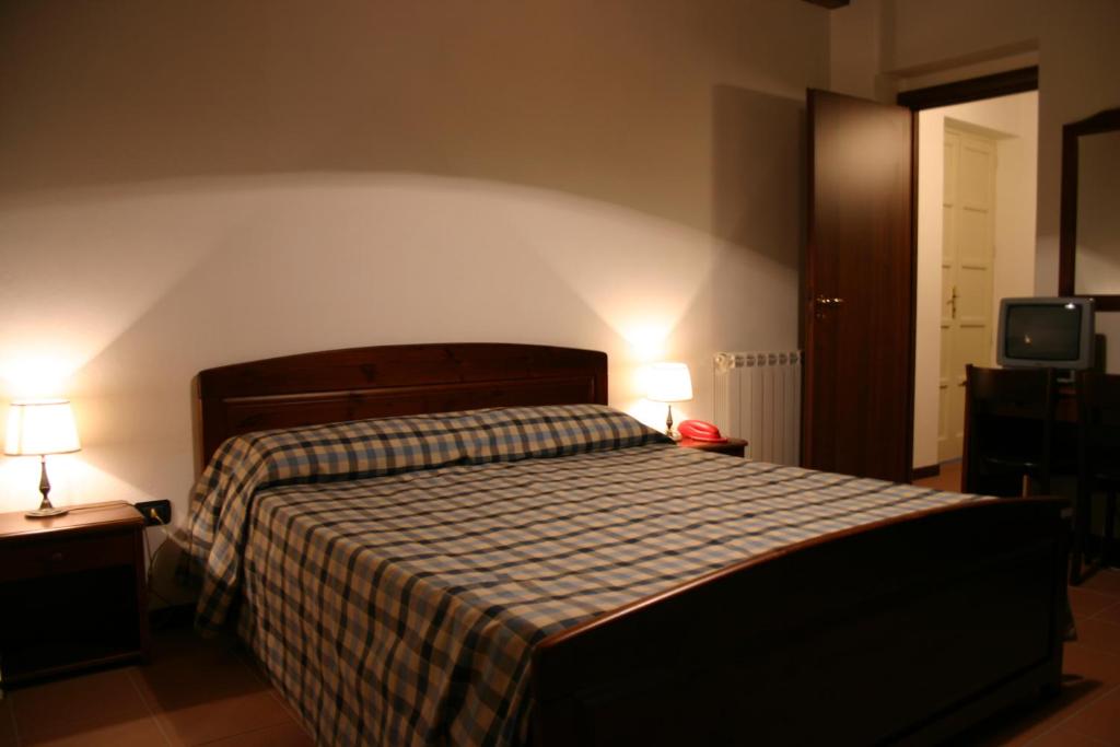 Postel nebo postele na pokoji v ubytování Agriturismo Simonello