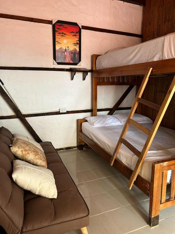 Postel nebo postele na pokoji v ubytování Hotel Gabarra Lodge