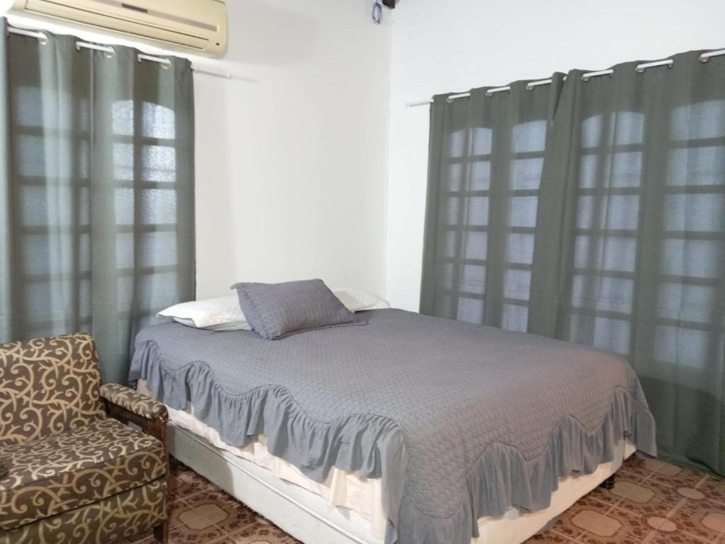 Giường trong phòng chung tại Lapacho Roga