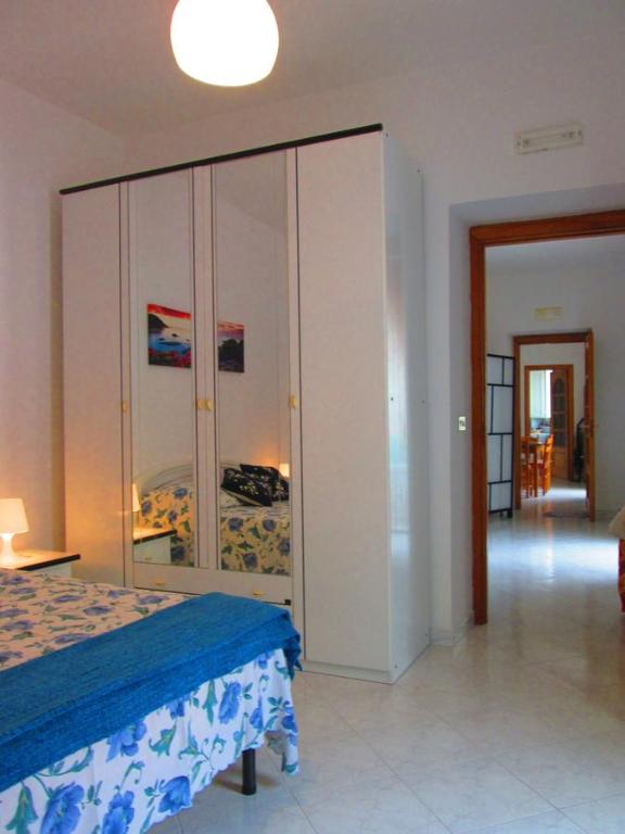 Łóżko lub łóżka w pokoju w obiekcie Casa Margherita