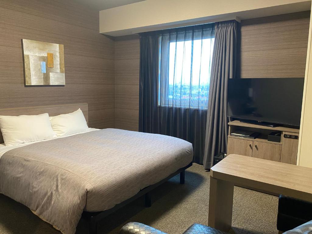 TV a/nebo společenská místnost v ubytování Hotel Route-Inn Ichihara