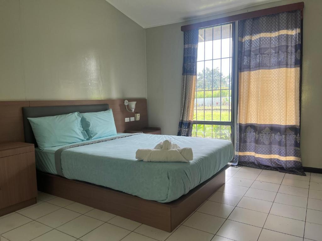Postel nebo postele na pokoji v ubytování Muruk lodge