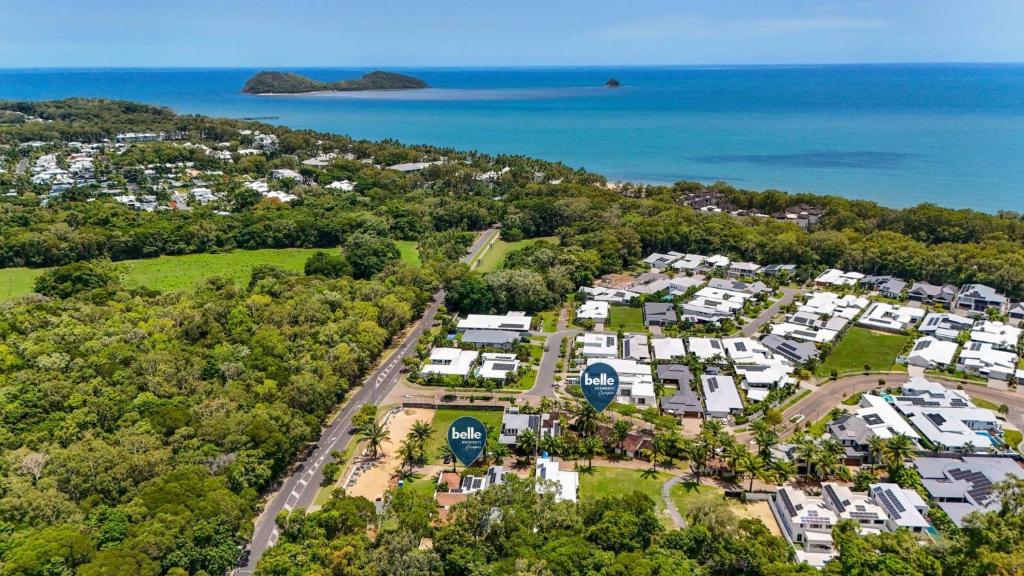 an aerial view of a resort with the ocean at Belle Escapes Pura Palm Cove - Two luxury Balinese villas in Palm Cove