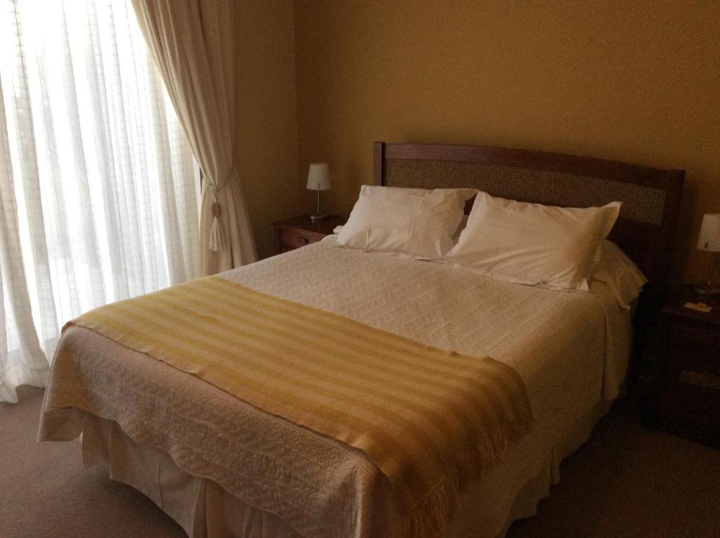 Postel nebo postele na pokoji v ubytování Hotel Patagonia Insular