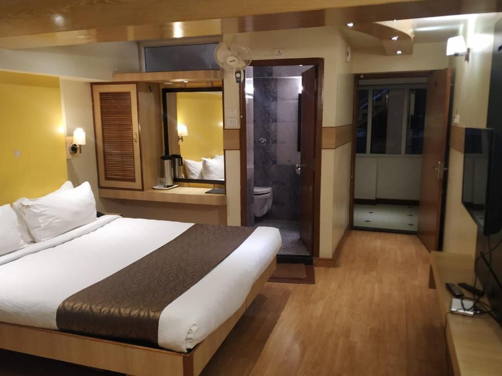 Postel nebo postele na pokoji v ubytování Darshan Resorts Pvt ltd