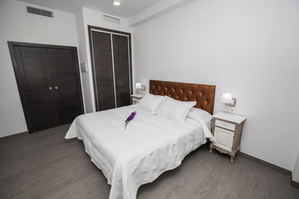 Postel nebo postele na pokoji v ubytování Hostal Boutique Bajamar
