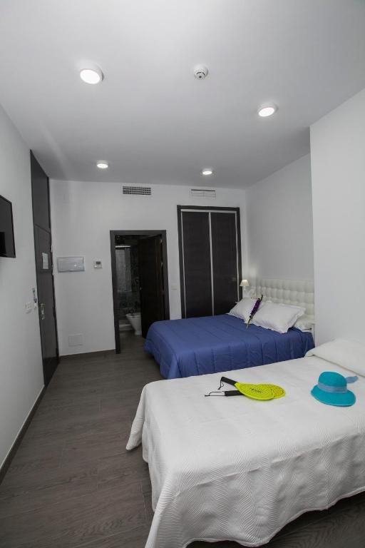 Postel nebo postele na pokoji v ubytování Hostal Boutique Bajamar
