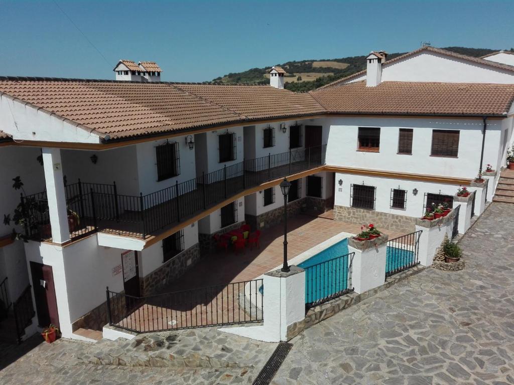 a large white house with a swimming pool at Casa Dominga in El Bosque