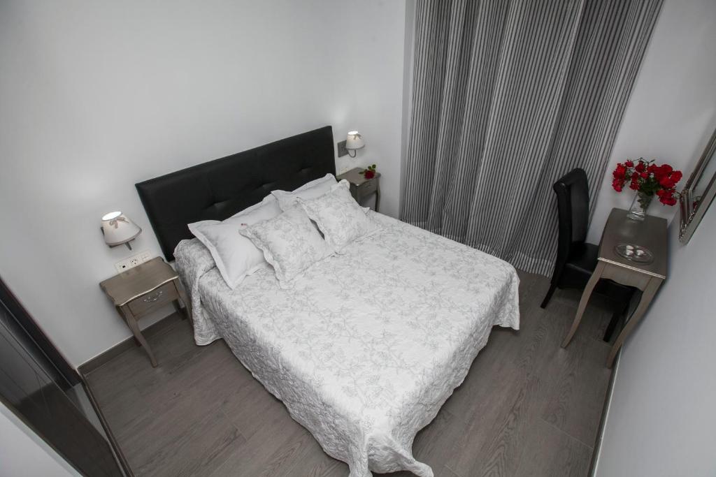 Postel nebo postele na pokoji v ubytování Hostal Boutique Bajamar