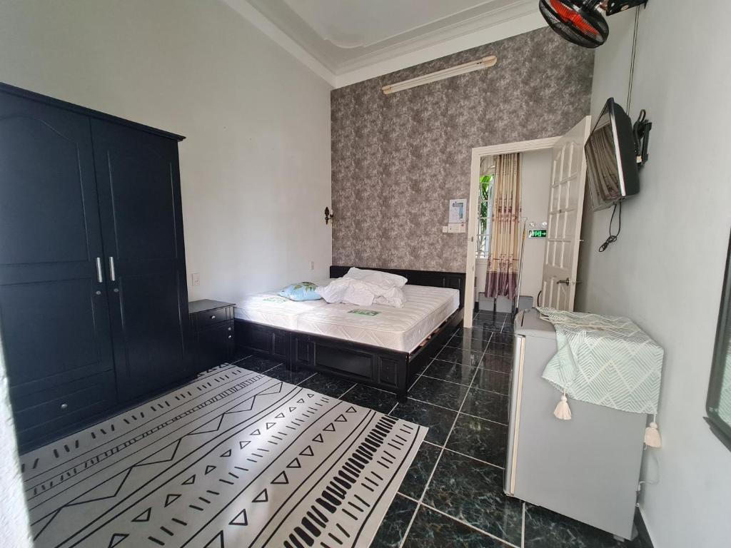 Postel nebo postele na pokoji v ubytování Happy Villa Hoi An