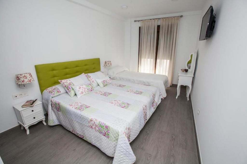 Postel nebo postele na pokoji v ubytování Hostal Boutique Bajamar