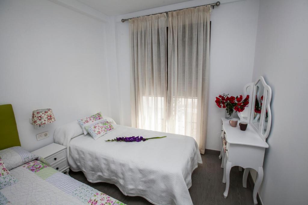 Postel nebo postele na pokoji v ubytování Hostal Boutique Bajamar