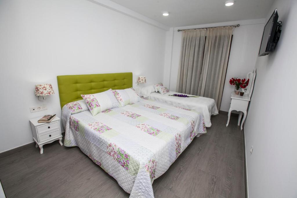 Postel nebo postele na pokoji v ubytování Hostal Boutique Bajamar