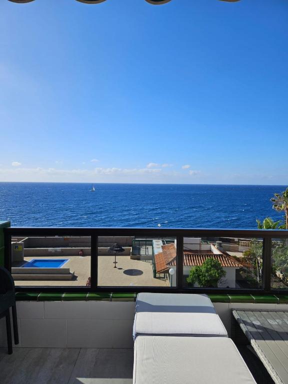 a balcony with a view of the ocean at Apartment mit Poolsicht in Costa Del Silencio