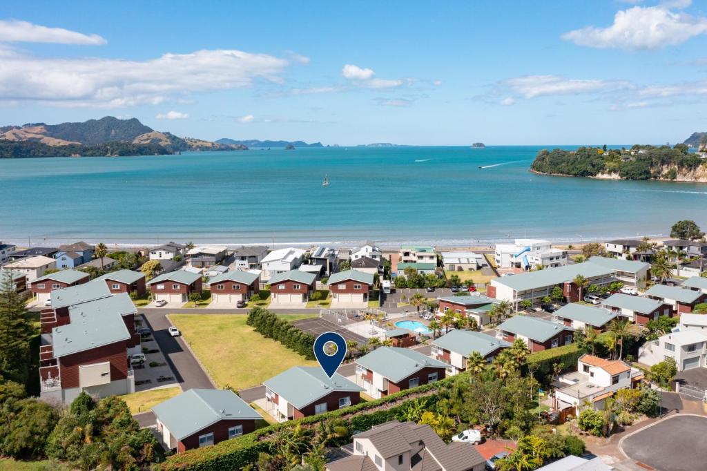 an aerial view of a town next to the ocean at Whitianga Coastal Stay, Cosy Studio at Oceans Resort in Whitianga