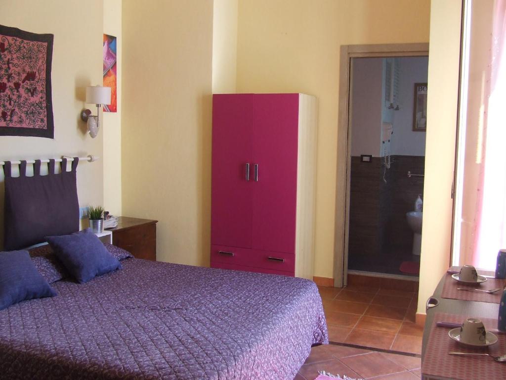 Postel nebo postele na pokoji v ubytování Mondello Room